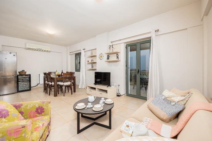 Open-plan living room with sofa, dining area, kitchen, A/C, WiFi internet, and satellite TV . - Villa Nora . (Photo Gallery) }}