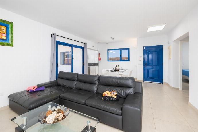 Open-plan living room with sofa, dining area, kitchen, A/C, WiFi internet, and satellite TV . - Villa Beyond . (Photo Gallery) }}