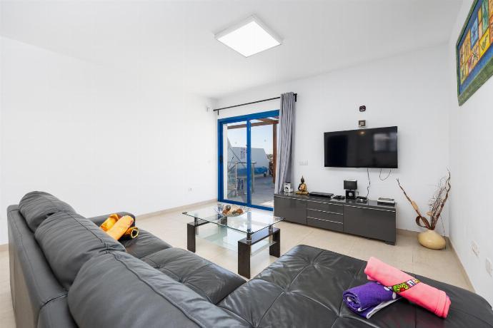 Open-plan living room with sofa, dining area, kitchen, A/C, WiFi internet, and satellite TV . - Villa Beyond . (Photo Gallery) }}
