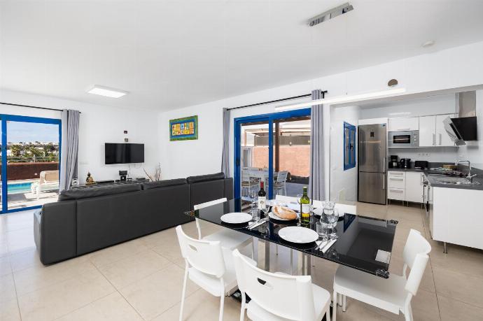 Open-plan living room with sofa, dining area, kitchen, A/C, WiFi internet, and satellite TV . - Villa Beyond . (Photo Gallery) }}