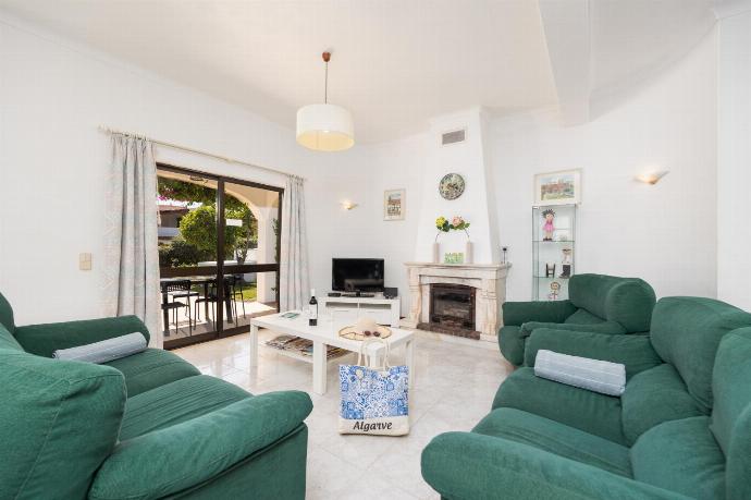 Living room with sofas, dining area, ornamental fireplace, WiFi internet, and satellite TV . - Villa Cavaco . (Galería de imágenes) }}