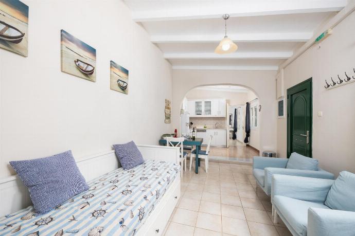 Open-plan living room with seating, dining area, kitchen, WiFi internet, and satellite TV . - Levrecchio Beach Cottage . (Photo Gallery) }}