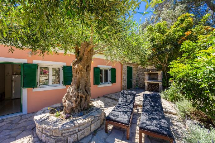 Terrace area with BBQ . - Levrecchio Beach Cottage . (Photo Gallery) }}