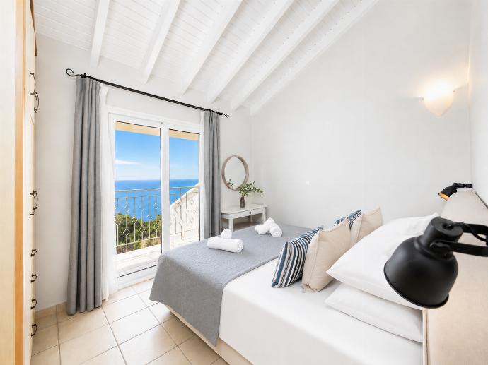 Double bedroom with A/C and sea views . - Villa Jasmine . (Photo Gallery) }}