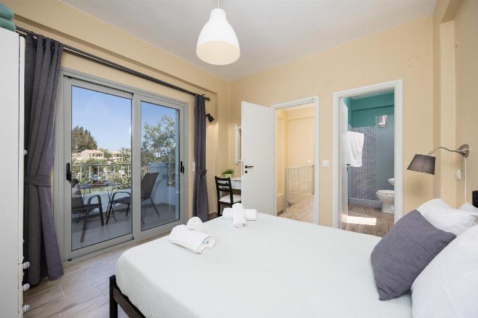 Double bedroom with en suite bathroom and A/C . - Villa Marmari . (Photo Gallery) }}