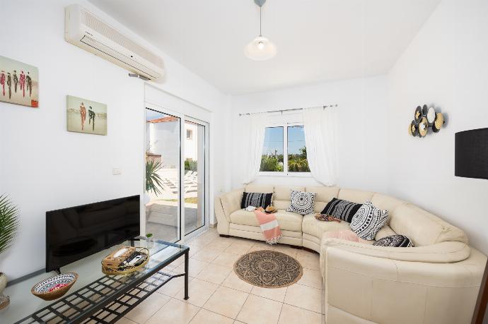 Open-plan living room with sofa, dining area, kitchen, A/C, WiFi internet, and satellite TV . - Villa Maia . (Photo Gallery) }}