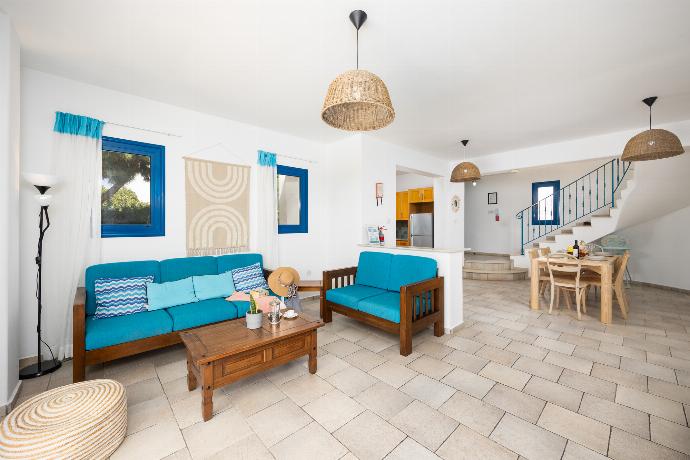 Open-plan living room with sofas, dining area, kitchen, A/C, WiFi internet, and satellite TV . - Villa Estia . (Photo Gallery) }}