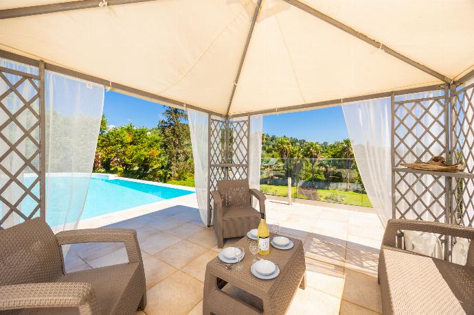 Sheltered terrace area . - Villa Noulia . (Photo Gallery) }}