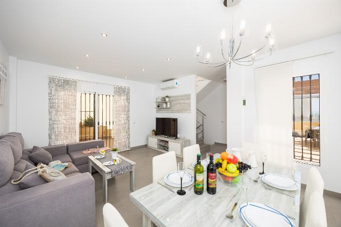 Living room with sofa, dining area, A/C, WiFi internet, and satellite TV . - Casa Eva . (Photo Gallery) }}
