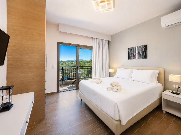 Double bedroom with A/C . - Villa Kyveli . (Photo Gallery) }}