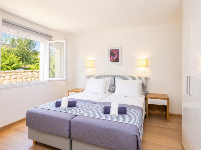 Twin bedroom with A/C . - Villa Penelope . (Photo Gallery) }}