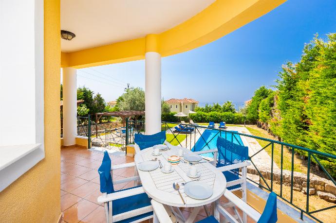 Sheltered terrace area with sea views . - Ionian Blue . (Photo Gallery) }}