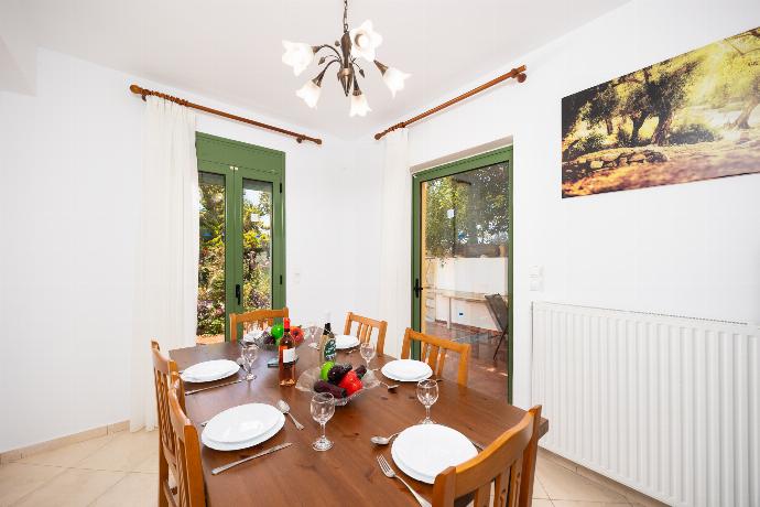Equipped kitchen with A/C and dining area . - Villa Atlantis . (Photo Gallery) }}