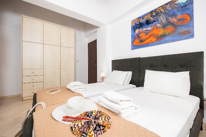 Twin bedroom with en suite bathroom and A/C . - Villa Atlantis . (Photo Gallery) }}