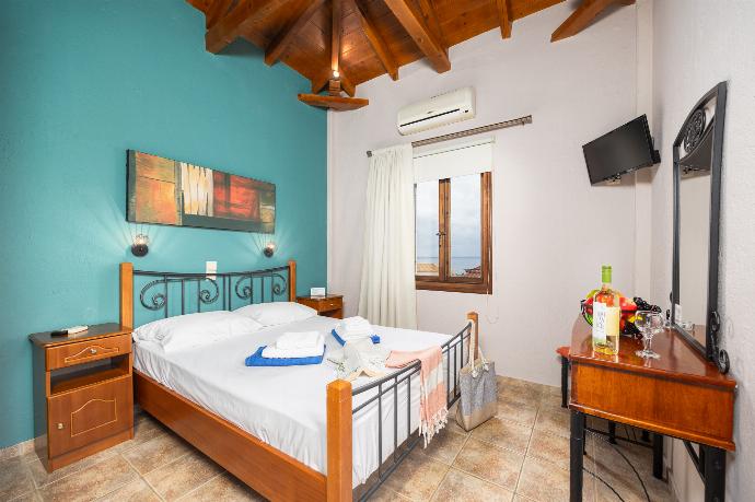 Unit 1: double bedroom with A/C . - Panorama II Villas . (Photo Gallery) }}