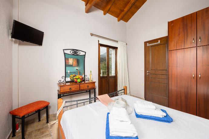 Unit 1: double bedroom with A/C . - Panorama II Villas . (Photo Gallery) }}