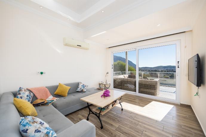 Open-plan living room with sofa, dining area, kitchen, A/C, WiFi internet, and satellite TV . - Residence Villa 1 . (Photo Gallery) }}