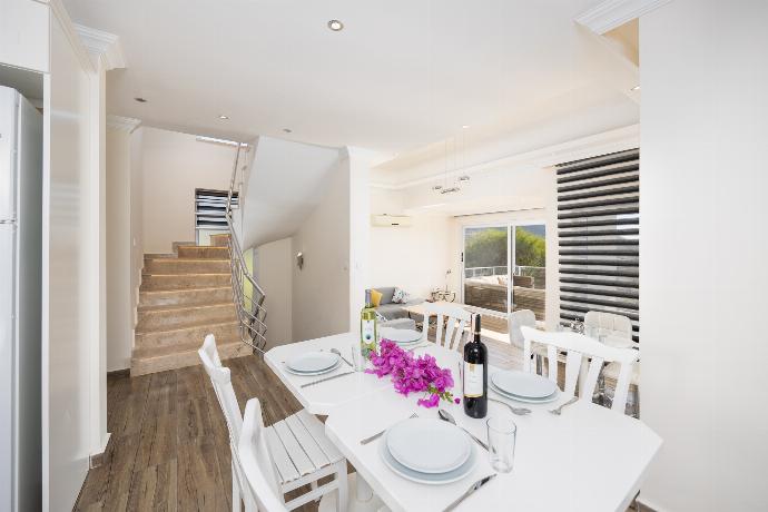 Open-plan living room with sofa, dining area, kitchen, A/C, WiFi internet, and satellite TV . - Residence Villa 1 . (Photo Gallery) }}