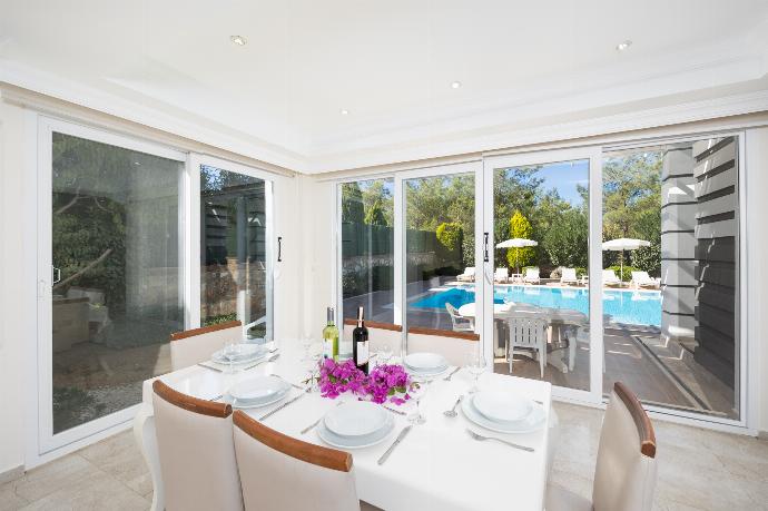 Open-plan living room with sofas, dining area, kitchen, A/C, WiFi internet, and satellite TV . - Four Seasons Villa . (Photo Gallery) }}