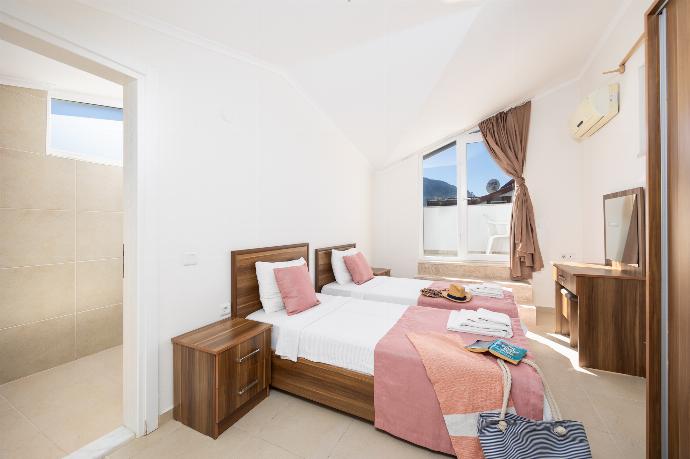 Twin bedroom with en suite bathroom and A/C . - Four Seasons Villa . (Photo Gallery) }}