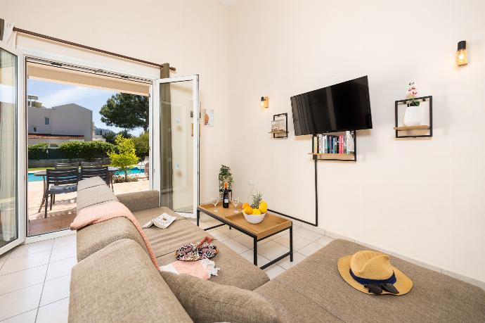 Living room with sofa, A/C, WiFi internet, and satellite TV . - Villa Athena Classico . (Photo Gallery) }}