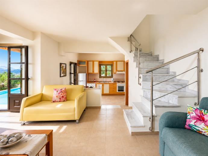 Open-plan living room with sofa, dining area, kitchen, A/C, WiFi internet, and satellite TV . - Villa Athina . (Photo Gallery) }}