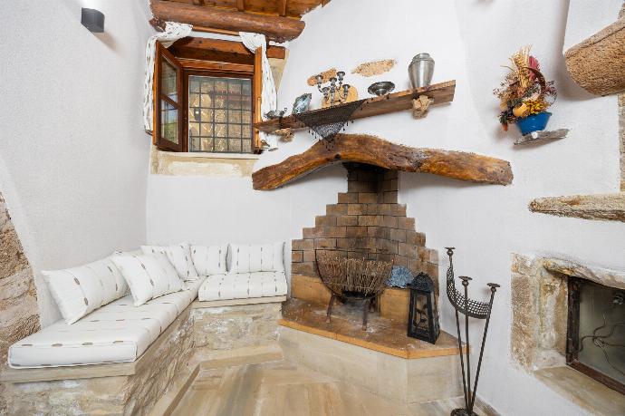 Living room with sofa, ornamental fireplace, A/C, WiFi internet, and satellite TV . - Villa Anta . (Photo Gallery) }}