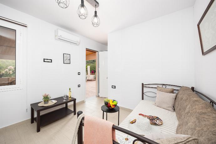 Annex: Open plan living room with sofa bed, kitchen, and A/C . - Villa Mazzeto Casa Alonia . (Photo Gallery) }}