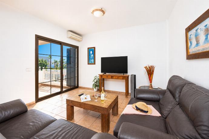 Living room with sofas, dining area, A/C, WiFi internet, and satellite TV . - Villa Diama . (Photo Gallery) }}