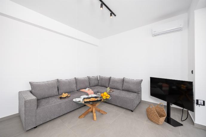 Open-plan living room with sofa, dining area, kitchen, A/C, WiFi internet, and satellite TV . - Villa 12 Chado . (Photo Gallery) }}