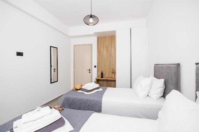 Twin bedroom with A/C . - Villa 12 Chado . (Photo Gallery) }}