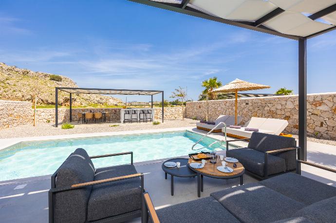 Sheltered terrace area . - Villa 12 Chado . (Photo Gallery) }}