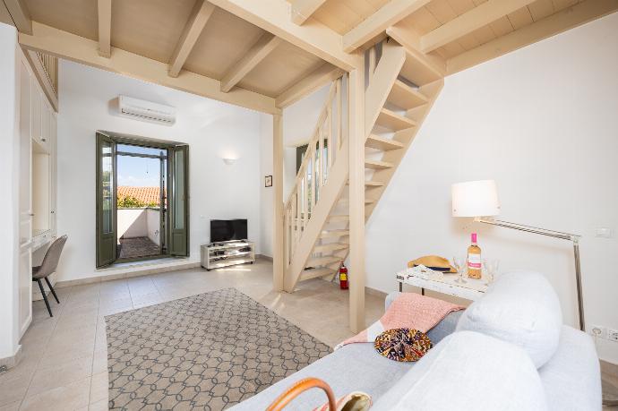 Main building: Bedroom with mezzanine, twin bed, sofa, ensuite bathroom, and A/C . - Villa Nafsika . (Photo Gallery) }}