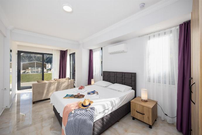 Annex: double bedroom with en suite bathroom and A/C . - Villa Tolga . (Photo Gallery) }}