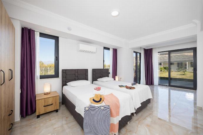 Annex: twin bedroom with en suite bathroom and A/C . - Villa Tolga . (Photo Gallery) }}