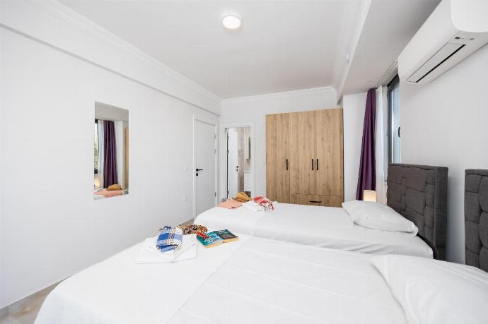 Annex: twin bedroom with en suite bathroom and A/C . - Villa Tolga . (Photo Gallery) }}