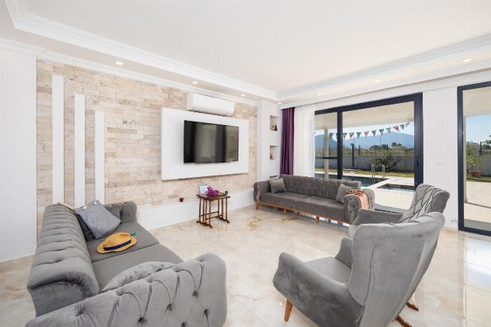 Main building: open-plan living room with sofas, dining area, kitchen, A/C, WiFi internet, and satellite TV . - Villa Funda . (Photo Gallery) }}