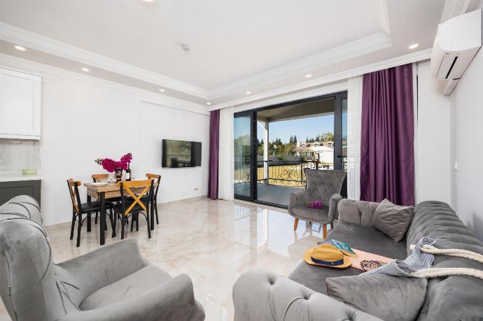 Annex: open-plan living room with sofa, dining area, kitchen, A/C, WiFi internet, and satellite TV . - Villa Funda . (Photo Gallery) }}