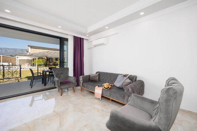 Annex: open-plan living room with sofa, dining area, kitchen, A/C, WiFi internet, and satellite TV . - Villa Funda . (Photo Gallery) }}