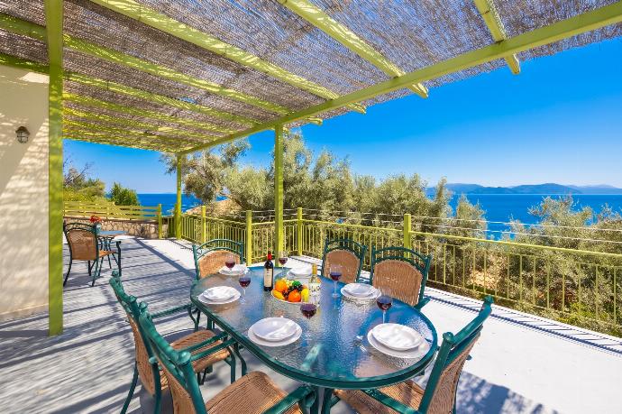 Sheltered terrace area with sea views . - Villa Anemus . (Photo Gallery) }}