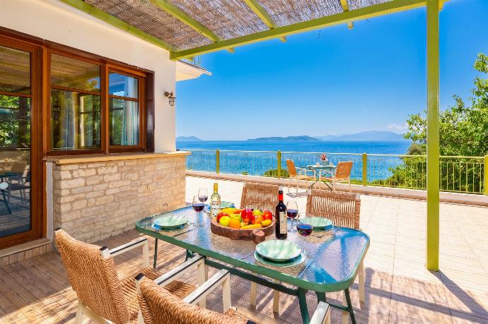 Sheltered terrace area with sea views . - Villa Pelagos Kyma . (Γκαλερί Φωτογραφιών) }}