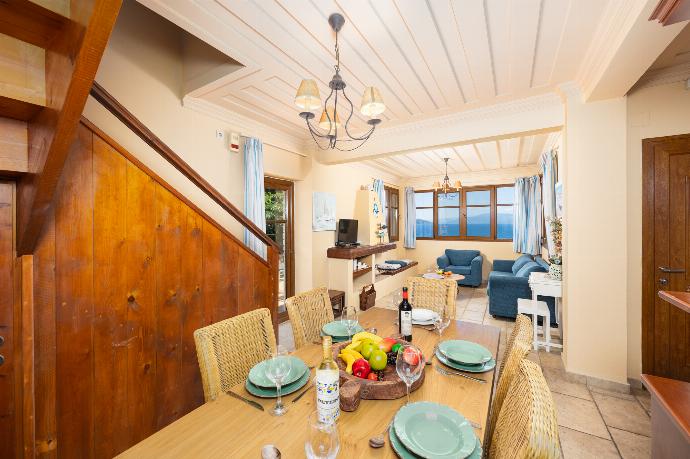 Open-plan living room with sofa, dining area, kitchen, A/C, WiFi internet, and satellite TV . - Villa Pelagos Kyma . (Γκαλερί Φωτογραφιών) }}