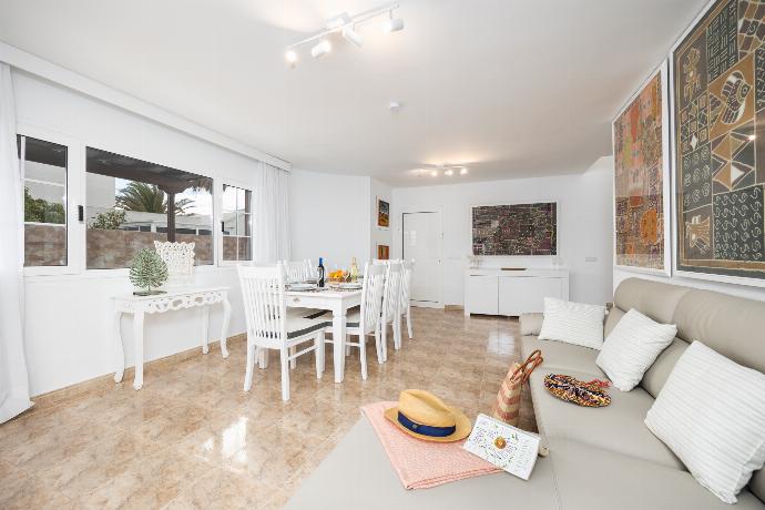 Living room with sofa, dining area, A/C, WiFi internet, and satellite TV . - Villa Eugina . (Photo Gallery) }}