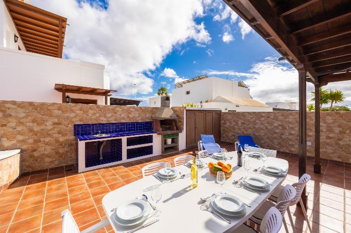 Sheltered terrace area . - Villa Eugina . (Photo Gallery) }}