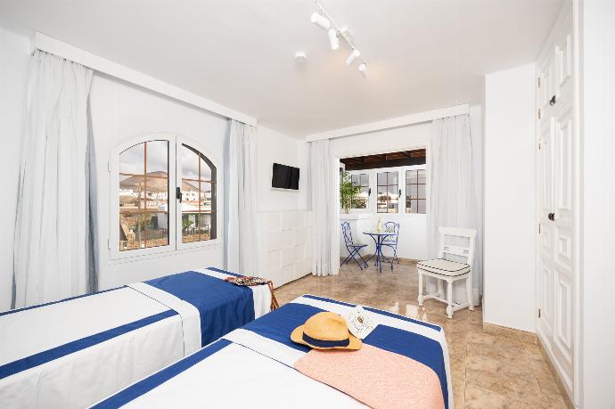 Twin bedroom with A/C . - Villa Eugina . (Photo Gallery) }}