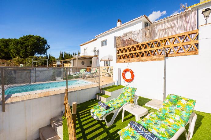 Terrace area with sea views . - Villa El Cortijo . (Photo Gallery) }}