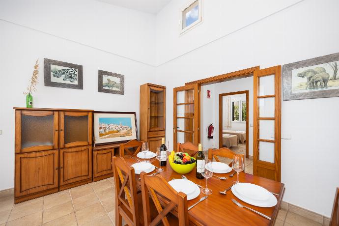 Living room with sofas, dining area, ornamental fireplace, WiFi internet, and satellite TV . - Villa Elena Dorada . (Galleria fotografica) }}