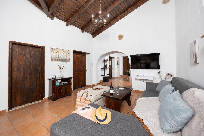 Open-plan living room with sofa, dining area, kitchen, ornamental fireplace, WiFi internet, and satellite TV . - Villa Roupes Stone . (Photo Gallery) }}