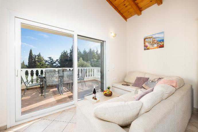 Open-plan living room with sofa, dining area, kitchen, A/C, WiFi internet, and satellite TV . - Villa Iremia . (Photo Gallery) }}