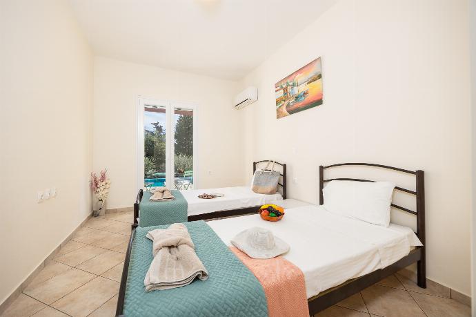 Twin bedroom with A/C . - Villa Iremia . (Photo Gallery) }}